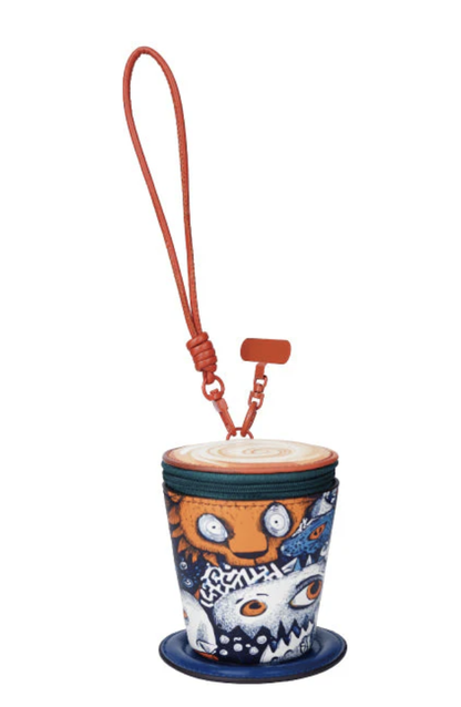Colorful cup holder with cartoon character design on a white background
